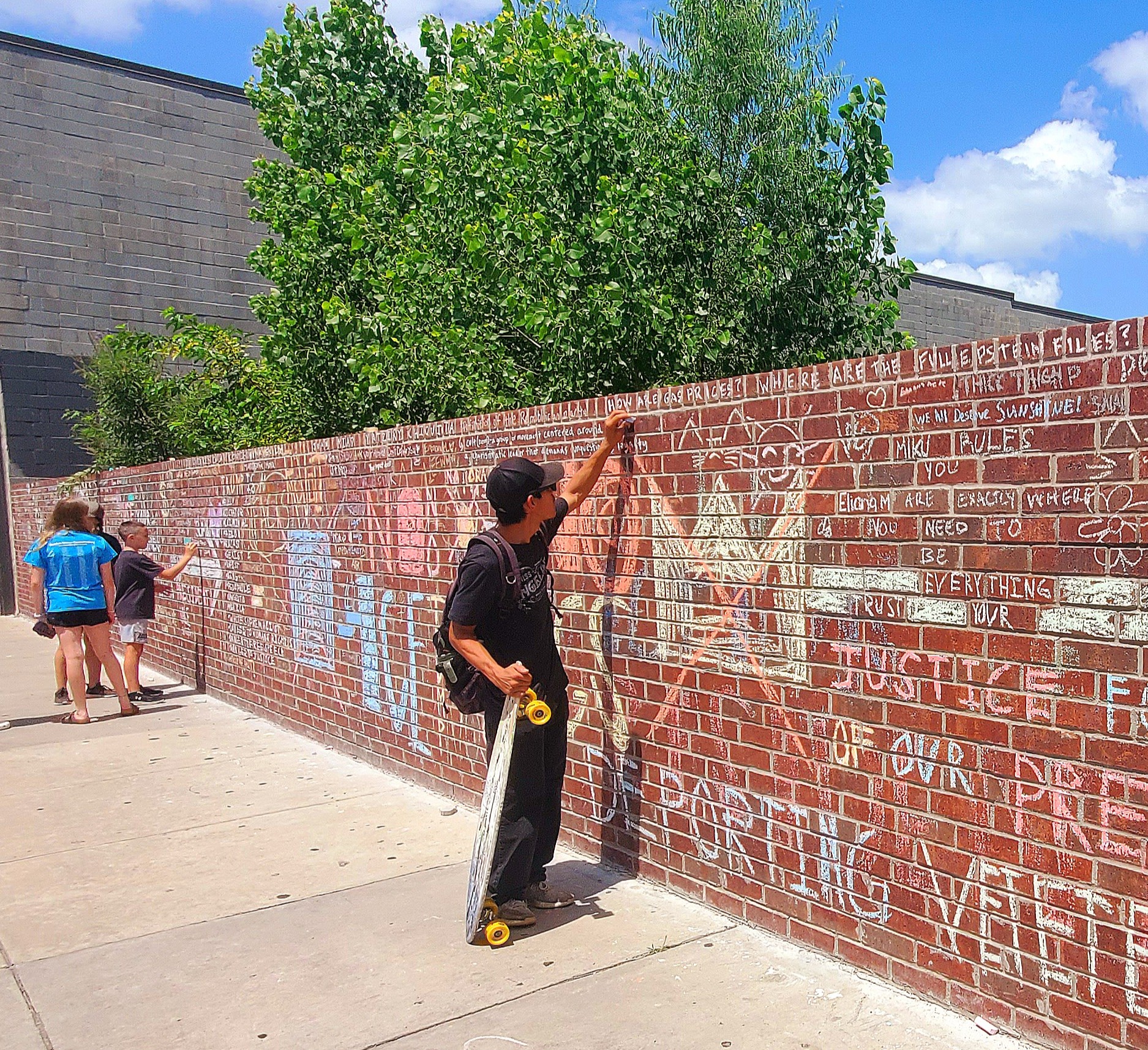 Photo: Chalk Resistance: The Denton Wall That Refuses to Be Erased